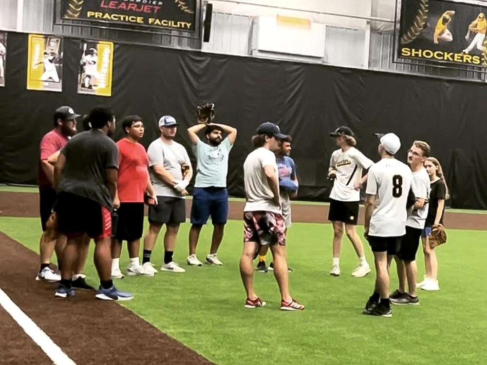 Wichita State University baseball club members in the indoor practice facility on campus.
