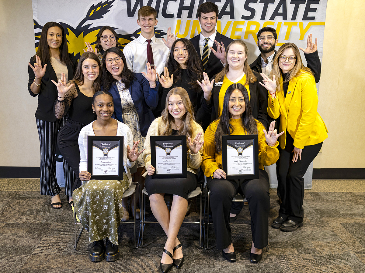 The 2023 Gore Scholars, front row: Jayden Island, Maley Hansen and Lesly Hernandez, pose for a photo with past recipients.