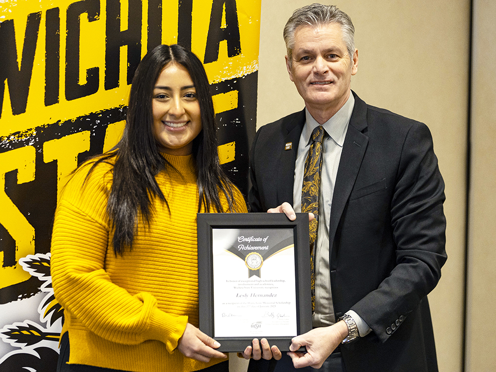 Lesly Hernandez and Dr. Rick Muma, President of Wichita State University, during the 2023 Gore Scholar Ceremony. 