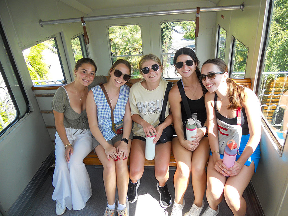 Sophie Walter, center, with members of the study abroad group on a gondola in Pau, France.