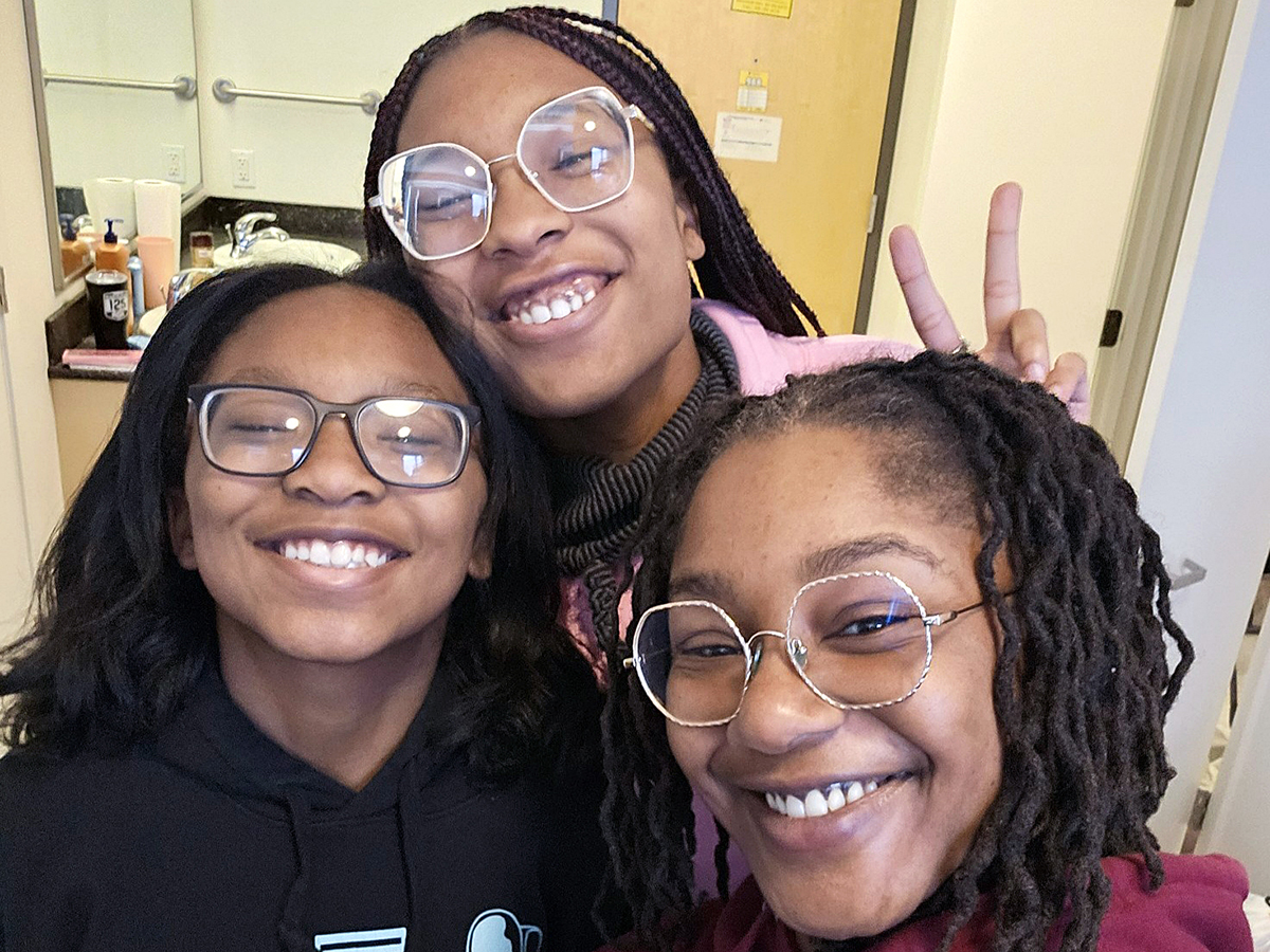 Amaya Willis, back, with her mother and sister on Move-In Day at Wichita State.