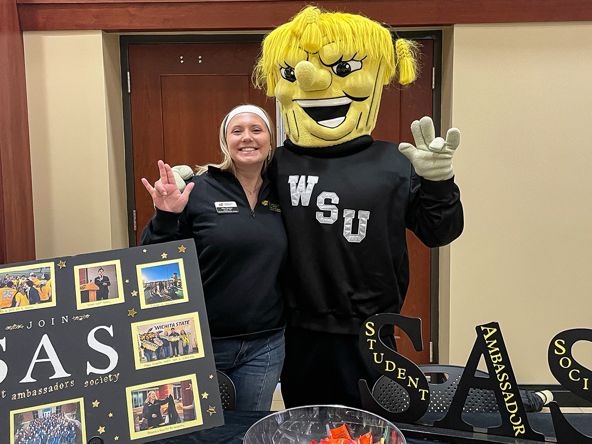 Chloe Strecker tabling at an event for the Student Ambassador Society with WuShock.