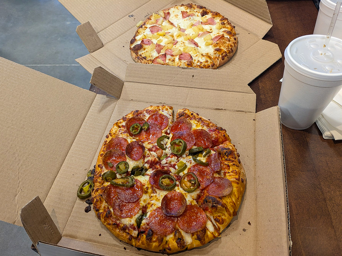 PIzza Shuttle 10" pies - one with pepperoni and jalapenos, and the other with pineapple and ham.