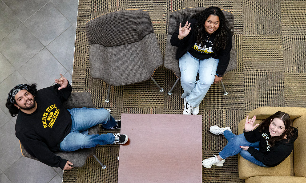 Transfer guides Yovani Cruz, Analiz Rivas and Andie Carley on the main floor of the Rhatigan Student Center.