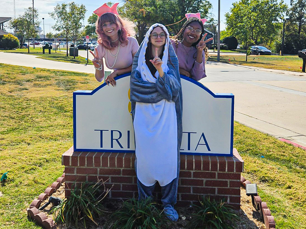 Amaya Willis with her sisters outside of the Tri Delta house.