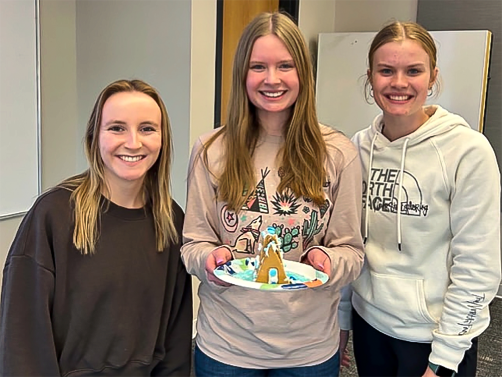 Annette Bradbury (left) and fellow WSUSSLHA members enjoying a gingerbread social during the organization's holiday meeting.