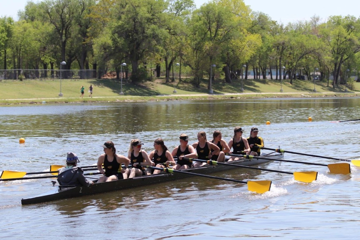 Women's 8 rowing down the river