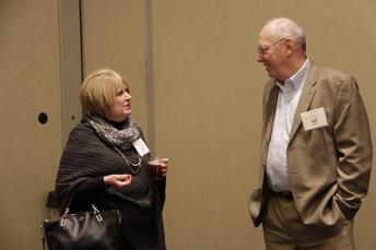 Photo of attendees visiting at the AET Reception. 