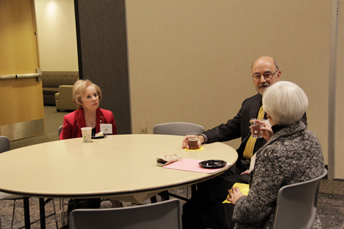 Photo of attendees visiting at the AET Reception. 