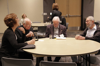 Photo of attendees visiting at the AET Reception. 