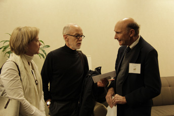 Photo of attendees visiting at the AET Reception. 