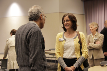 Photo of Gina Brown, AET Teaching Award recipient, visiting with Ed Sawan.