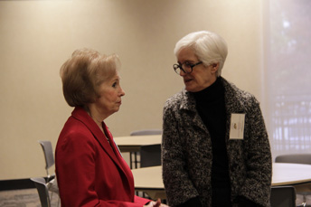 Photo of attendees visiting at the AET Reception. 