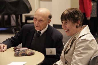 Photo of attendees visiting at the AET Reception. 