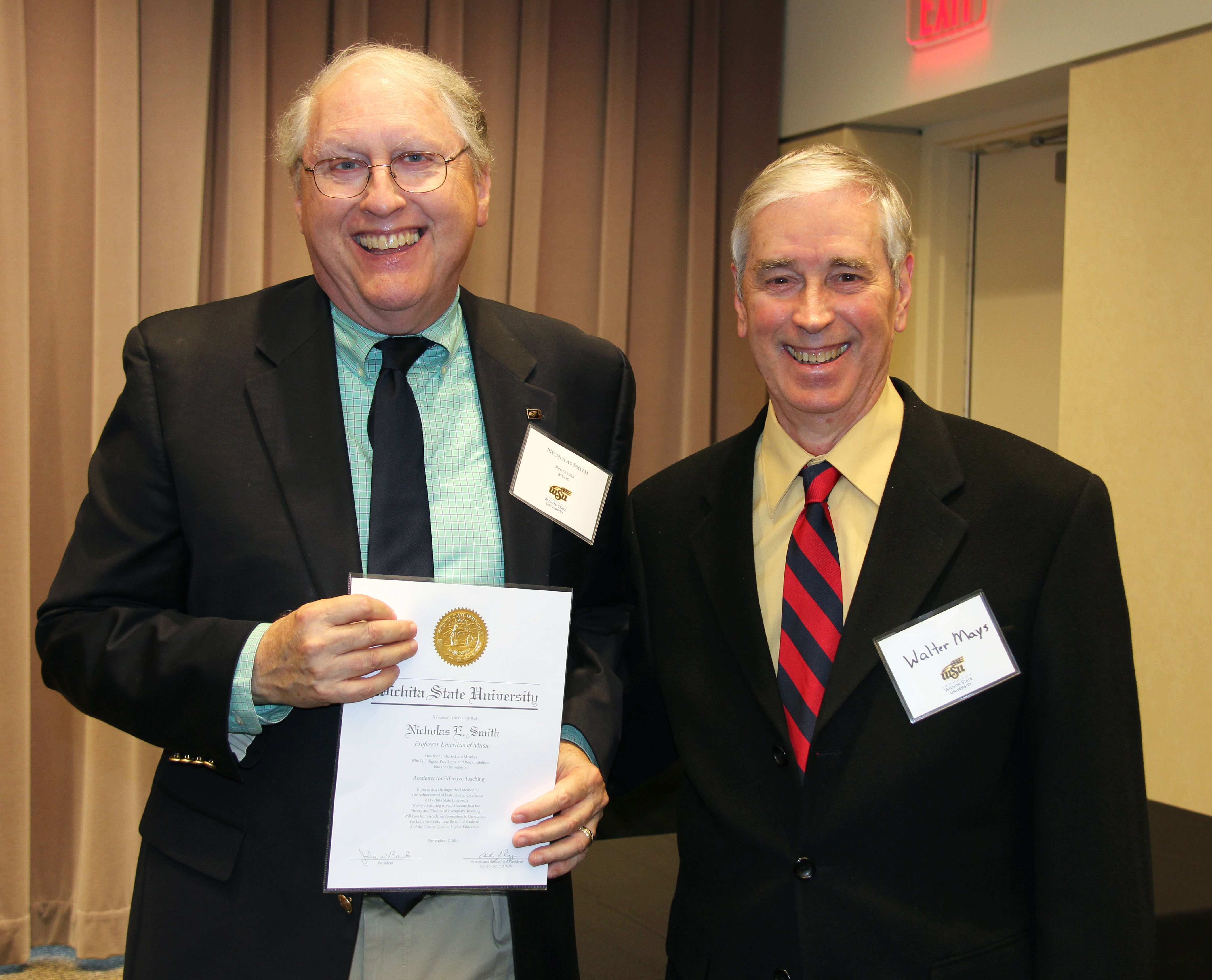 Photo of Walter Mays presenting Nicholas Smith with his certificate.