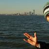 Jonathan Dennill poses with the skyline while riding the ferry into New York City. Dennill studied at William Paterson University of New Jersey through National Student Exchange