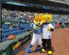 Wu posing with Sluggerrr at Kauffmann Stadium in Kansas CIty was a dream come true for Wu—he's a huge Royals fan.