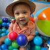 A child plays in a ball pit