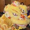 Children smile during the Chinese dragon dance.