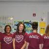 Staff members pose in their Child Development Center shirts.