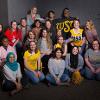 A group of Teacher Assistants smile.