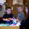 Two children learn about magnets.