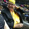 Dr. Bardo dons Wu Shock headgear prior to a Shocker women's basketball game.