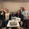 VA staff poses with their coffee, cookies and donuts for VA Appreciation Day. 