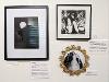 Three works of art hanging on a wall: a black and white photograph, a lithograph, and a small mixed media piece.
