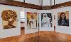 Four large paintings of women.