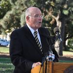 A speaker stands at a podium