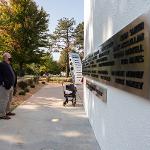 A man looks at the south side of the memorial