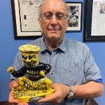 A man poses with a WuShock decanter