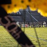 Memorial '70 wreath, up close. You can see letters on the field through the wreath's opening that say, "Gone, but not forgotten."