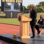 Courtney Marshall speaks at a podium