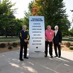 Crash survivors gather in front of the survivor's monument