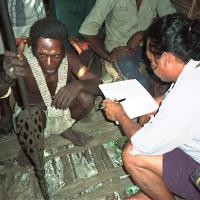 A crew member collects information