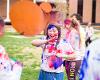 A student participates in the annual Holi celebration