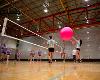 Students play in the annual Big Pink Volleyball game for charity. Proceeds go toward Breast Cancer Research