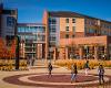 Students walk past Shocker Hall on a fall day