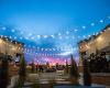 Patio string lights illuminate Braeburn Square at dusk during the WSU Open House.