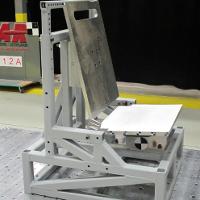 Impact launcher with rigid seat