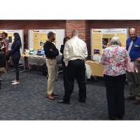 Poster presentations included information about research and creative activity, grant procurement, awards and publications. Representatives from each area answered  questions about their department.