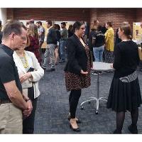 Poster presentations included information about research and creative activity, grant procurement, awards and publications. Representatives from each area answered  questions about their department.