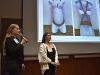 Jessica Gorton and Rosa Chicas standing at the front of the auditorium in Devlin Hall presenting at the Finals.