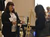 Olivia presents the team's business model and prototype to a judge.