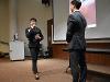 Jun walks towards Keenan to demonstrate the way the software and haptic sensors on the vest work together as a navigation aid. 