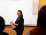A woman presenting her pitch during a training session.