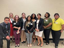 Group photo of research presenters