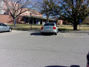 Photo of ADA parking by Duerksen south of building.